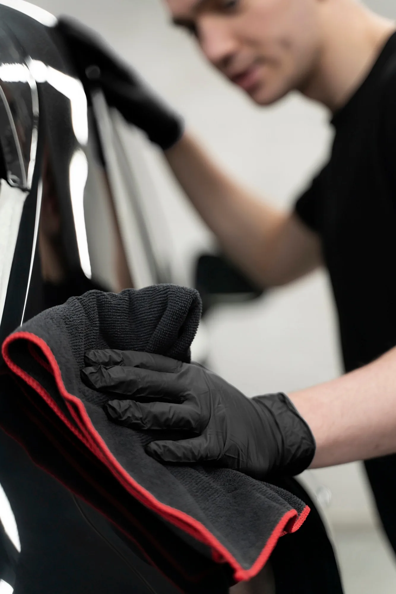 Paint protection film being applied to a vehicle bonnet